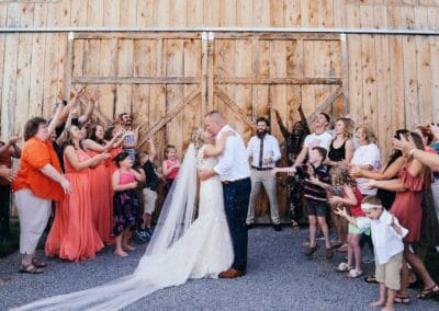 Guests shower newlyweds with rice outside The Barn at Stony Creek Farm in Dungannon, Virginia.