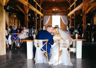 A recently married couple kiss during heir wedding reception at The Barn at Stony Creek Farm in Dungannon, Virginia.