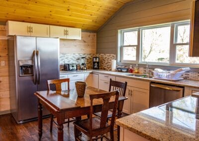 Natural lights shines through the window and into the kitchen of Happy Trails Cottage.