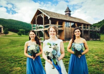 A bride and her bridesmaids pose for photographs at The Lodge at Crooked River.