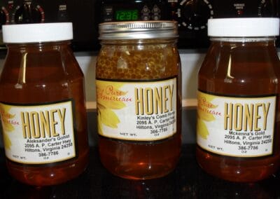 Three jars of honey varieties that are available to purchase from Poor Valley Bee Farm in Scott County, Virginia.