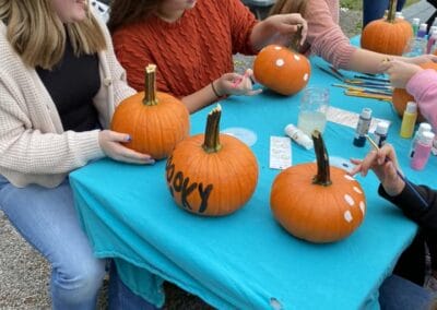 A group of lady's painting pumpkins at Pungo Farms.